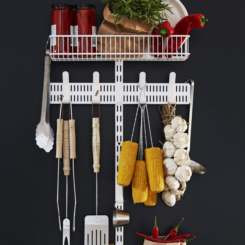 Elfa laundry wall storage with drying shelf and mesh baskets