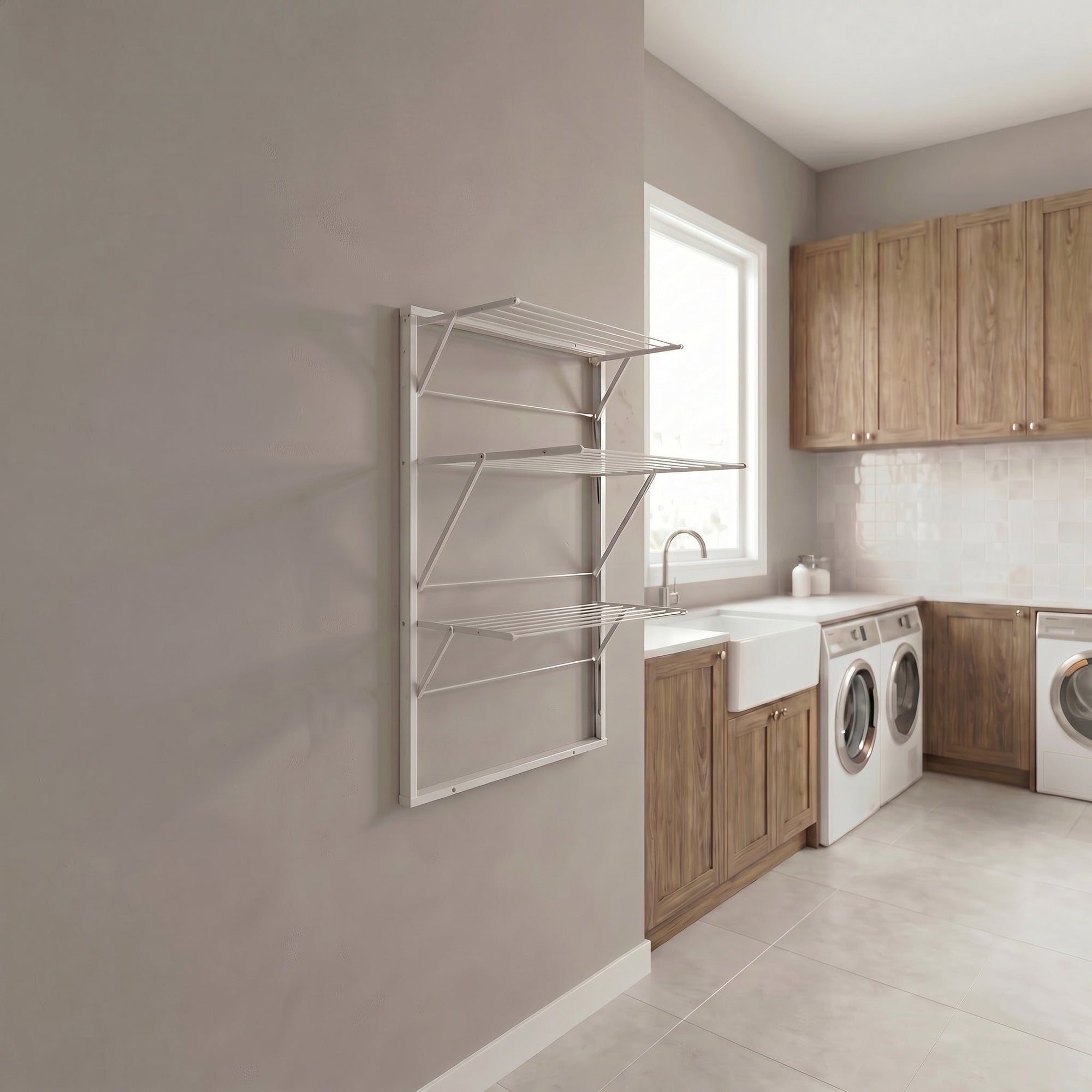 A rust proof aluminium clothes airer on a grey tiled wall
