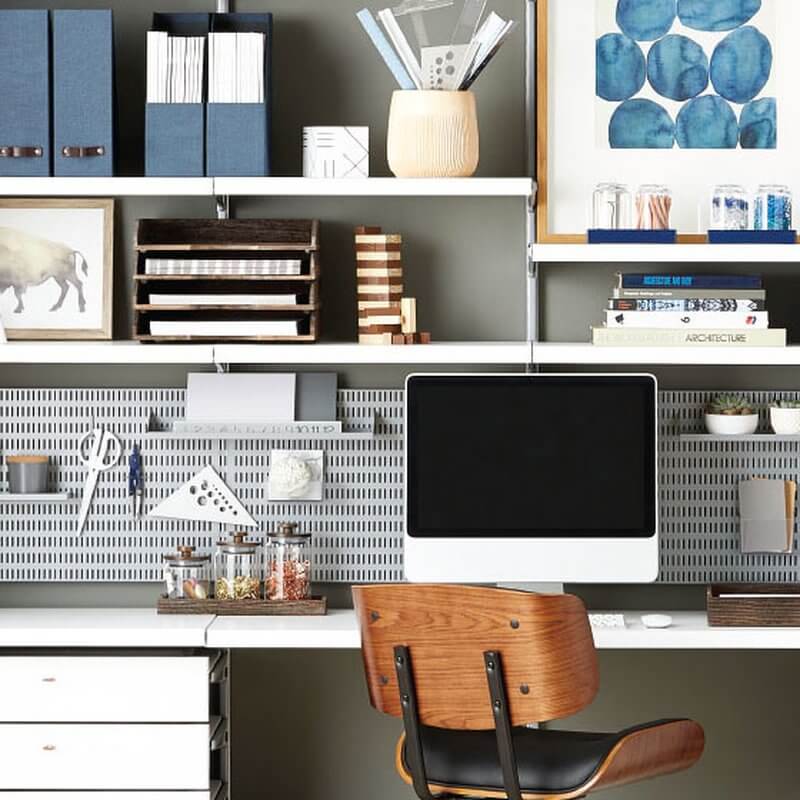 A home office with White Elfa Click In Melamine Shelves and Platinum Storing Boards installed